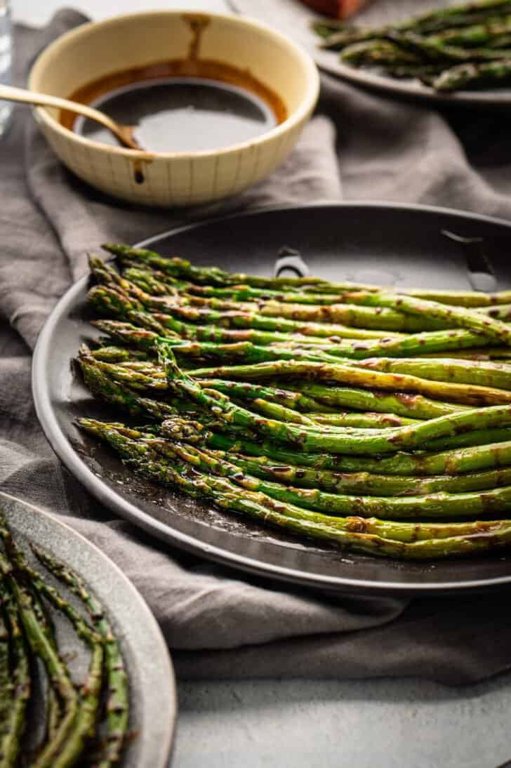 Roasted spring vegetables with a dark syrup sauce.