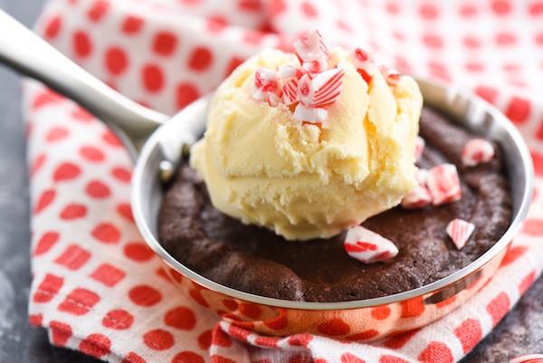 Double Peppermint Brownie Skillets for Two - Peppermint-infused brownies topped with vanilla ice cream and crushed candy cakes. Bake in mini skillets or ramekins for an adorable presentation! | foxeslovelemons.com