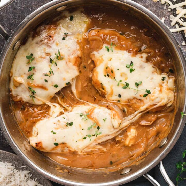 French Onion Chicken in a stainless steel skillet.