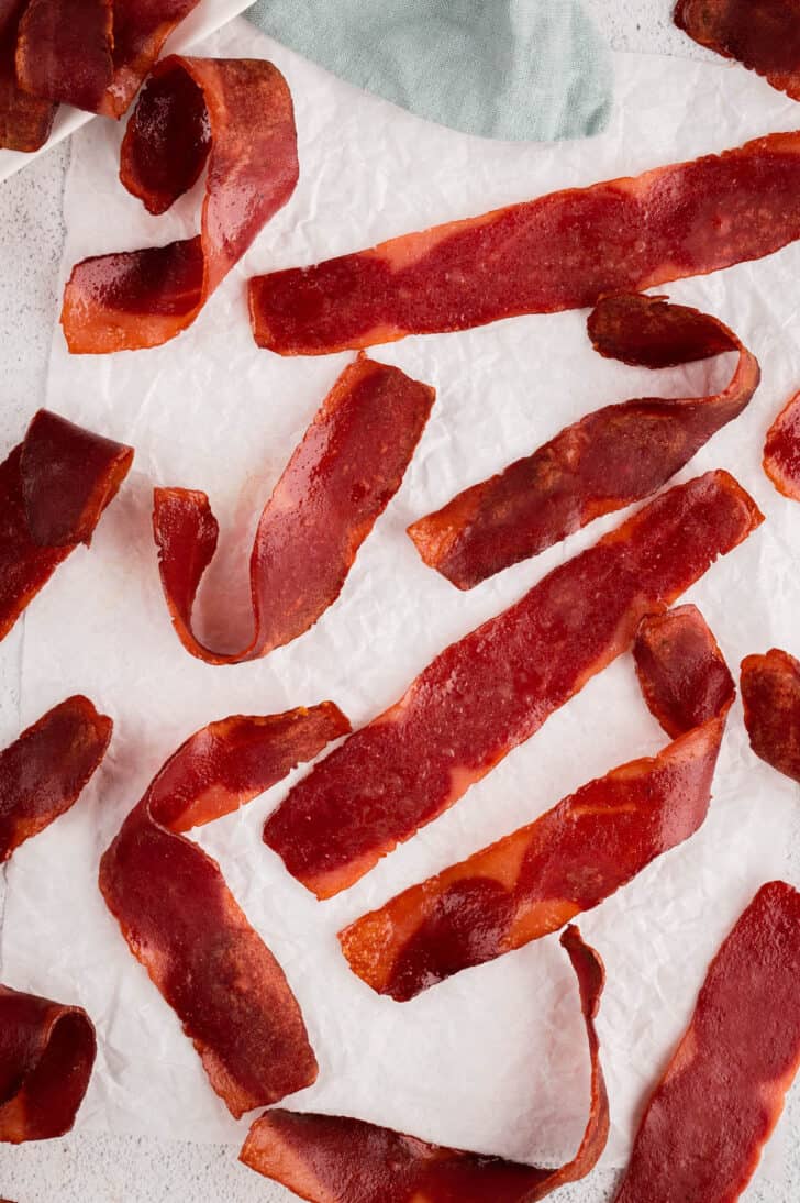 Cooked air fryer turkey bacon resting on a paper towel.