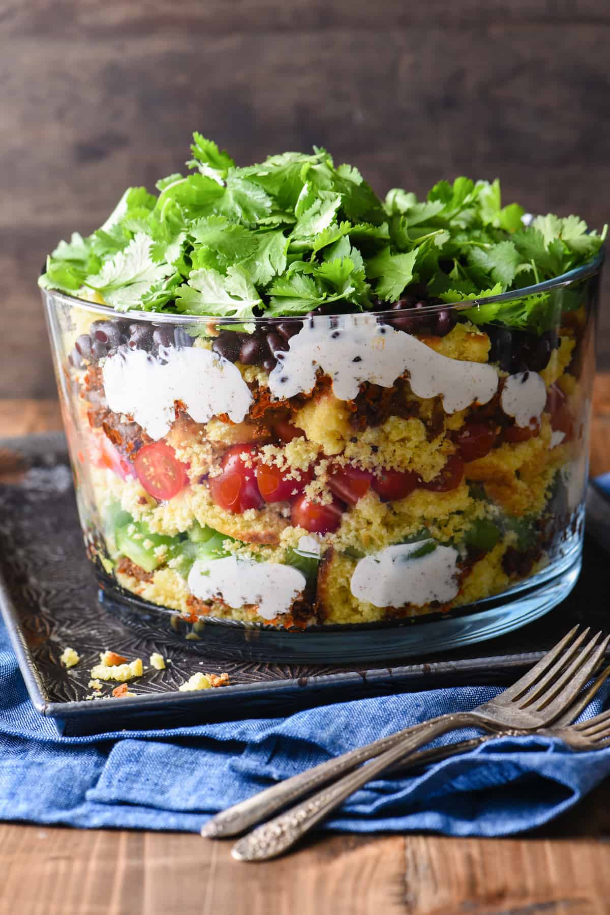 Having a backyard barbecue or going to a potluck? This Layered Southwestern Cornbread Salad can be made in advance and served cold. With the layers of colors and flavors, it's certain to stand out on the buffet table. | foxeslovelemons.com Having a backyard barbecue or going to a potluck? This Layered Southwestern Cornbread Salad can be made in advance and served cold. With the layers of colors and flavors, it's certain to stand out on the buffet table. | foxeslovelemons.com