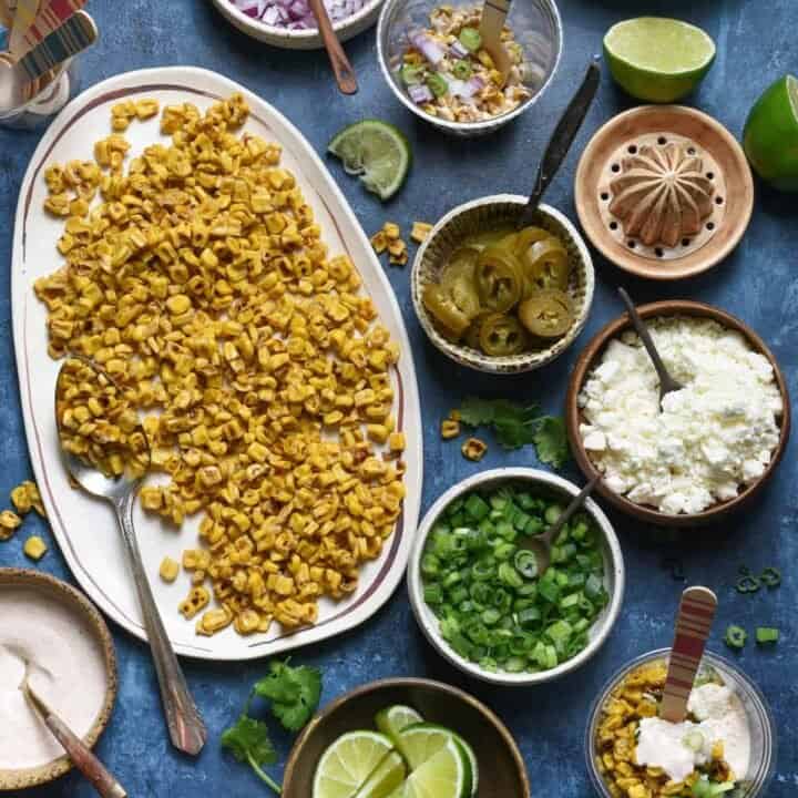 Having a fiesta? Please the whole crowd with this Mexican Street Corn Salad Bar. Gather all of the ingredients for classic Mexican street corn (elote), but let everybody assemble their own. Perfect for the spice lovers, the picky eaters, and the cilantro-adverse! | foxeslovelemons.com