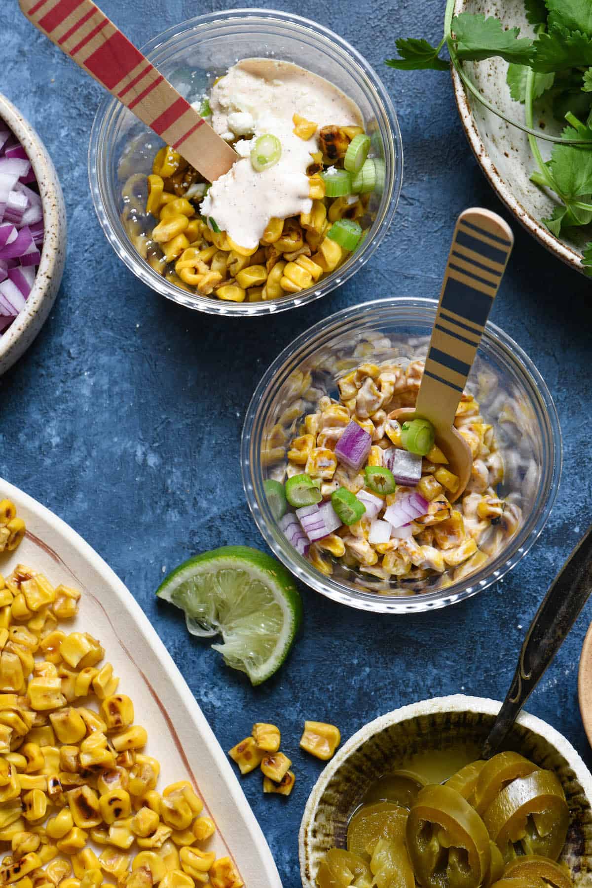 Having a fiesta? Please the whole crowd with this Mexican Street Corn Salad Bar. Gather all of the ingredients for classic Mexican street corn (elote), but let everybody assemble their own. Perfect for the spice lovers, the picky eaters, and the cilantro-adverse! | foxeslovelemons.com Having a fiesta? Please the whole crowd with this Mexican Street Corn Salad Bar. Gather all of the ingredients for classic Mexican street corn (elote), but let everybody assemble their own. Perfect for the spice lovers, the picky eaters, and the cilantro-adverse! | foxeslovelemons.com