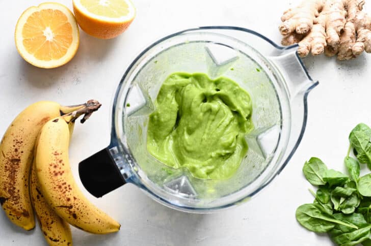 A smooth green mixture in a blender pitcher.