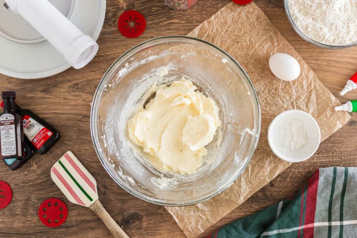 A glass bowl with a creamed mixture of butter and sugar.