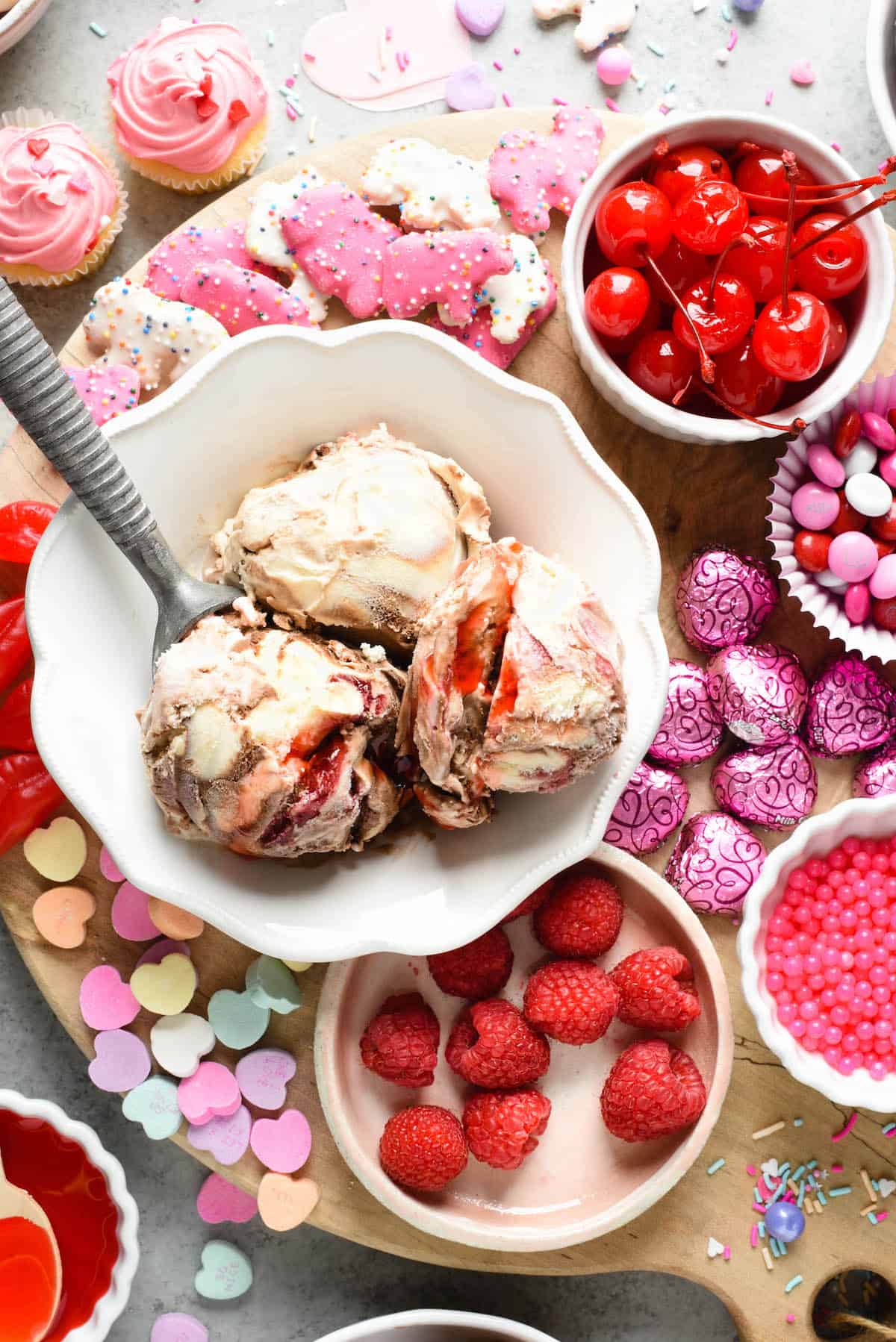 Make the holiday extra sweet with this dreamy Valentine's Day Dessert Board featuring ice cream, fruit, candies, chocolate and sprinkles! | foxeslovelemons.com Make the holiday extra sweet with this dreamy Valentine's Day Dessert Board featuring ice cream, fruit, candies, chocolate and sprinkles! | foxeslovelemons.com